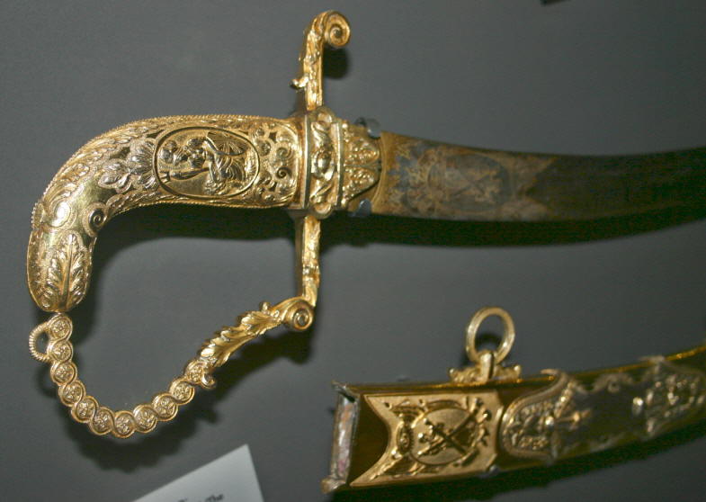 Trip gold sword.jpg